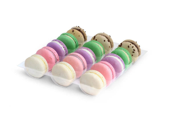 Set of colorful macaron-shaped bath bombs on a white background