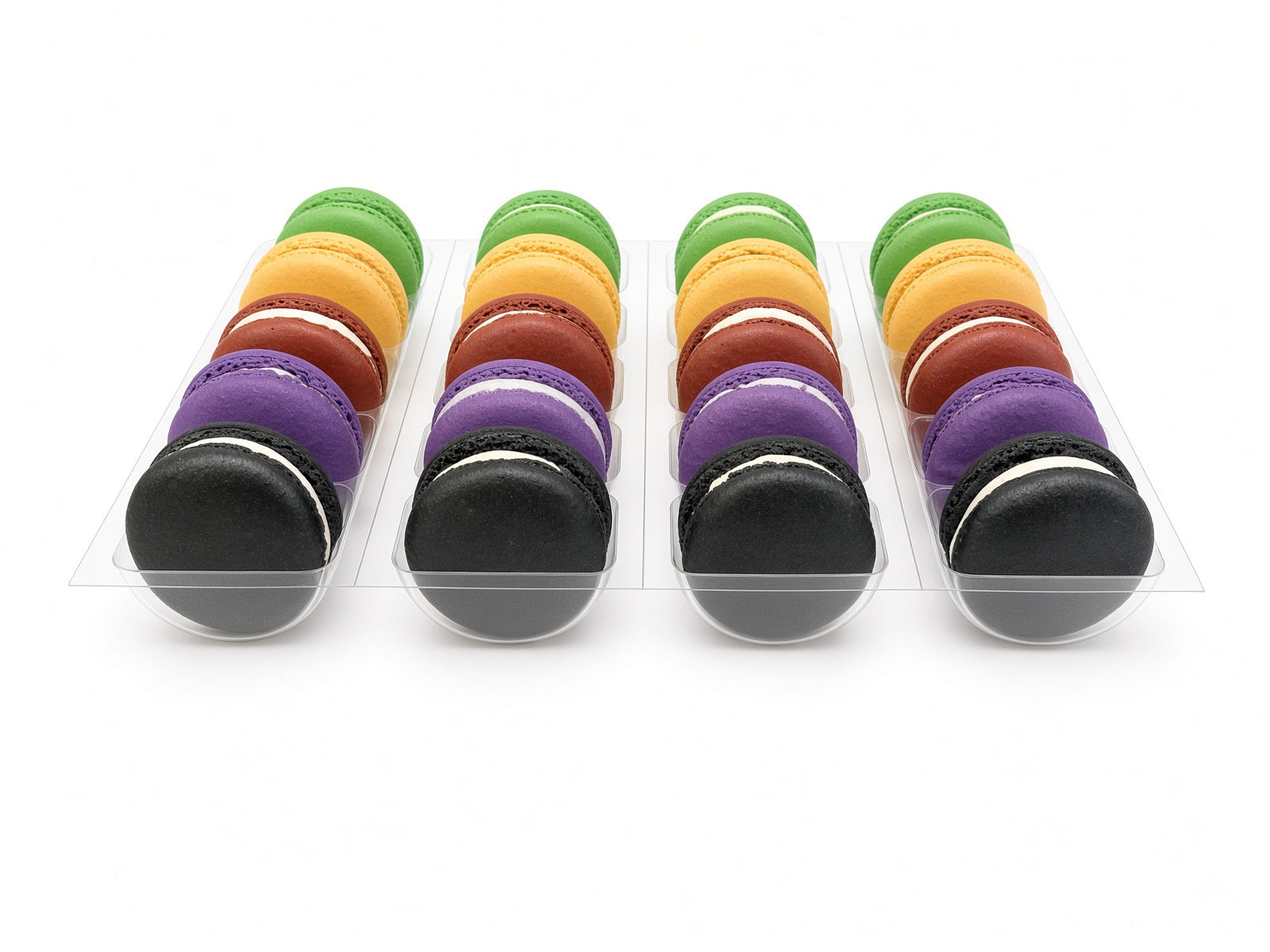 Halloween Box of 20 macarons in rows of black, purple, red, orange and green, seen from a low angle
